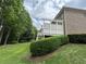 View of backyard brick house and deck and green lawn at 608 Tabbystone Nw St, Marietta, GA 30064
