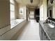 Bright bathroom with a soaking tub, double vanities, and ample natural light at 608 Tabbystone Nw St, Marietta, GA 30064