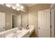 Bathroom with sink, large mirror, vanity, and white cabinets at 608 Tabbystone Nw St, Marietta, GA 30064