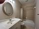 Cozy bathroom featuring a vanity with oval mirror and a shower-tub combination at 608 Tabbystone Nw St, Marietta, GA 30064