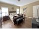 Bedroom featuring hardwood floors, crown molding, and a dark wood bed frame with leather bench at 608 Tabbystone Nw St, Marietta, GA 30064