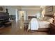 Large bedroom with wood floors, sitting area, and a view to the ensuite bathroom at 608 Tabbystone Nw St, Marietta, GA 30064