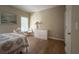 Bright bedroom featuring hardwood floors, white trim, and lots of natural light at 608 Tabbystone Nw St, Marietta, GA 30064