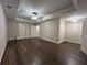 Spacious bedroom featuring a tray ceiling and hardwood floors at 608 Tabbystone Nw St, Marietta, GA 30064