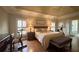 Spacious bedroom with tray ceiling and workout equipment, including an exercise bike at 608 Tabbystone Nw St, Marietta, GA 30064
