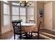 Charming breakfast nook featuring a round table, shuttered windows, and a chandelier at 608 Tabbystone Nw St, Marietta, GA 30064