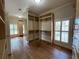 Walk-in closet with custom built-in shelving and natural light at 608 Tabbystone Nw St, Marietta, GA 30064