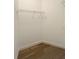Walk-in closet featuring hardwood floors, wire shelving, and white trim at 608 Tabbystone Nw St, Marietta, GA 30064