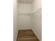 Empty walk-in closet with hardwood floors and wire shelving to maximize storage at 608 Tabbystone Nw St, Marietta, GA 30064