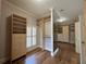 Custom walk-in closet featuring built in drawers, shelves, and hardwood flooring at 608 Tabbystone Nw St, Marietta, GA 30064