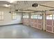 Spacious three car garage with white walls and pink doors at 608 Tabbystone Nw St, Marietta, GA 30064