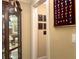 Hallway with framed art and a display case showing various medals and awards at 608 Tabbystone Nw St, Marietta, GA 30064