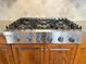 Stainless steel range with six burners and wooden cabinets at 608 Tabbystone Nw St, Marietta, GA 30064