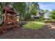 Large backyard with playground, relaxing lounge area, and wooded scenery at 615 Wilson Nw Rd, Atlanta, GA 30318
