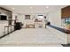 Finished basement with custom bar, seating, built-in window bench, and play area at 615 Wilson Nw Rd, Atlanta, GA 30318