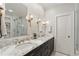 Elegant bathroom with marble countertop, dual sinks, and modern lighting at 615 Wilson Nw Rd, Atlanta, GA 30318