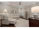 Cozy Bedroom with striped walls, white furniture, and abundant natural light at 615 Wilson Nw Rd, Atlanta, GA 30318