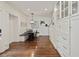 Inviting dining area with built-in bench seating, modern lighting, and ample storage cabinets at 615 Wilson Nw Rd, Atlanta, GA 30318