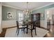 Elegant dining room with wainscoting, chandelier, and a view to the kitchen at 615 Wilson Nw Rd, Atlanta, GA 30318