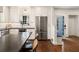Bright kitchen with stainless steel appliances, a breakfast bar, and sleek countertops for modern cooking at 615 Wilson Nw Rd, Atlanta, GA 30318