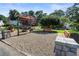 Outdoor park area featuring mature trees, landscaping, benches, and play areas at 615 Wilson Nw Rd, Atlanta, GA 30318