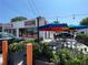 Exterior view of Zunzi's restaurant with outdoor seating and colorful umbrellas at 615 Wilson Nw Rd, Atlanta, GA 30318