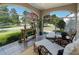 Bright sunroom featuring wicker seating, ample natural light, and scenic views at 615 Wilson Nw Rd, Atlanta, GA 30318