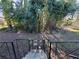 Backyard showing stairs, dense foliage, and shed at 1452 Mercer Ave, Atlanta, GA 30337