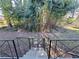 View of the backyard from stairs, showing dense foliage at 1452 Mercer Ave, Atlanta, GA 30337