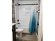 Bathroom features shower and tub with a white and blue curtain at 1452 Mercer Ave, Atlanta, GA 30337