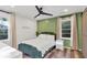 Bright bedroom features a ceiling fan, natural light and a modern design at 1452 Mercer Ave, Atlanta, GA 30337