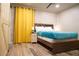 Bright bedroom with a sliding closet door, and beachy decor at 1452 Mercer Ave, Atlanta, GA 30337