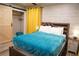 Bright bedroom with a sliding closet door, and beachy decor at 1452 Mercer Ave, Atlanta, GA 30337