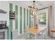 Charming dining area with a wood table, stylish rope light fixture, and bright natural light at 1452 Mercer Ave, Atlanta, GA 30337
