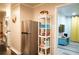 Kitchen with stainless steel refrigerator, washer and dryer and bright yellow curtains in adjacent room at 1452 Mercer Ave, Atlanta, GA 30337