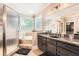 Bathroom featuring a tub/shower combo, granite countertop, and dark wood cabinets at 692 Heritage Post Ln, Grayson, GA 30017
