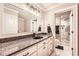 Bathroom featuring granite countertops, marble floors, and a glass-enclosed shower at 692 Heritage Post Ln, Grayson, GA 30017