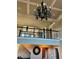 Open foyer with an ornate chandelier, decorative wrought iron railings and a clock at 692 Heritage Post Ln, Grayson, GA 30017