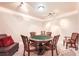 Game room with card table, plush chairs, and cozy lighting, perfect for entertaining at 692 Heritage Post Ln, Grayson, GA 30017