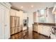 Gourmet kitchen with stainless steel appliances, granite countertops, and custom cabinetry at 692 Heritage Post Ln, Grayson, GA 30017