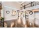 Spacious living room with hardwood floors, stone fireplace, and open staircase at 692 Heritage Post Ln, Grayson, GA 30017