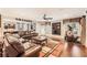 Spacious living room boasts hardwood floors, a large TV, and comfortable leather seating at 692 Heritage Post Ln, Grayson, GA 30017