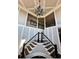 Elegant staircase with decorative iron railings and trim leading to the second floor at 692 Heritage Post Ln, Grayson, GA 30017