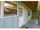 Charming exterior with pale green siding, white trim, and natural wood porch ceiling at 986 Greenwood Ne Ave # 4, Atlanta, GA 30306
