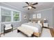 Comfortable bedroom with a ceiling fan, hardwood floors, and a bright window with views at 986 Greenwood Ne Ave # 4, Atlanta, GA 30306