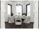 Elegant dining room with a round table, seating for six, and large windows with natural light at 11530 Serenbe Ln, Chattahoochee Hills, GA 30268