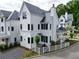 A modern-traditional style home with white siding and a dark gray roof at 11530 Serenbe Ln, Chattahoochee Hills, GA 30268