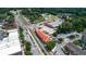 Aerial view of a train station with restaurant with street traffic and nearby parking at 116 Via Roma, Woodstock, GA 30188