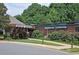 Community aquatic center featuring brick construction, a welcoming entrance, and adjacent parking at 116 Via Roma, Woodstock, GA 30188