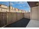 Fenced backyard with wood perimeter offering space for outdoor enjoyment and privacy at 116 Via Roma, Woodstock, GA 30188